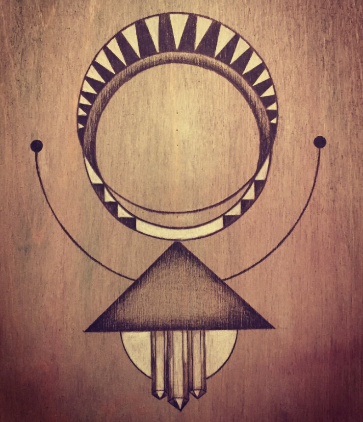 Sacred geometry drawing on birch wood