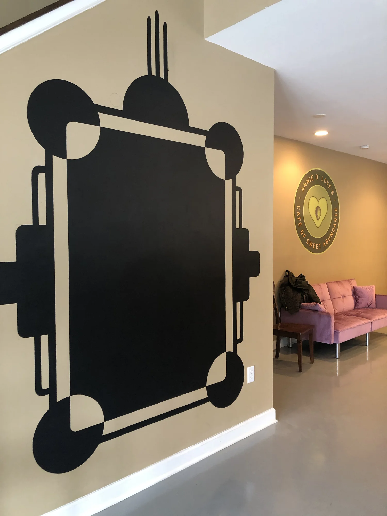 Annie O's Cafe interior with geometric mural, Charleston SC