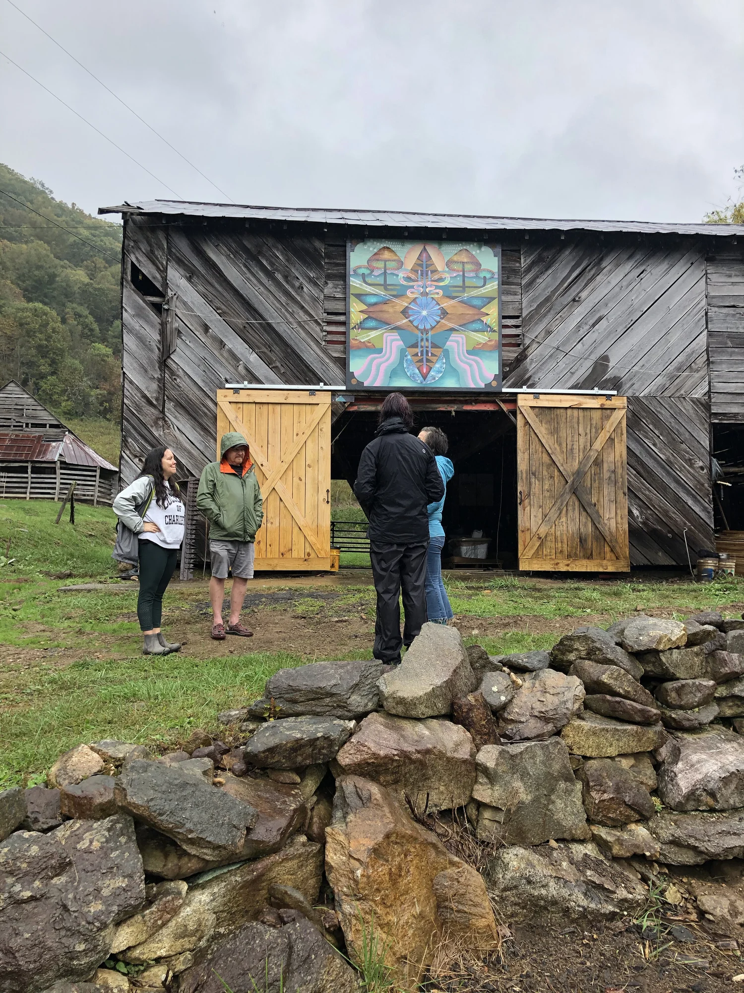 Sarah painting the Mushroom Barn Quilt mural